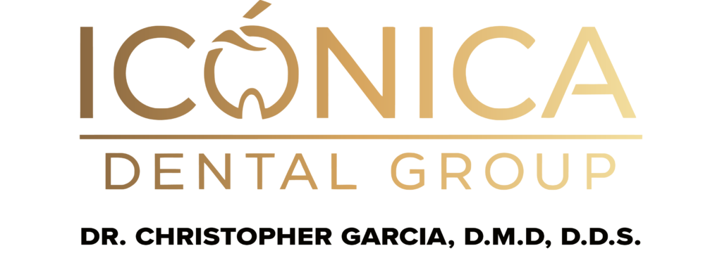 Primary transparent logo asset for icónica dental group featuring the elegant gold brand name and stylized apple icon. Positioned directly underneath is the black capital lettering reading 'DR. CHRISTOPHER GARCIA, D.M.D. D.D.S.' to signify our luxury concierge dentistry and advanced oral surgery focus in Hallandale Beach.